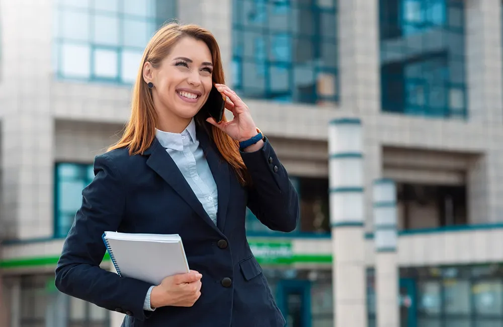 Symsafe client on a call outside her office