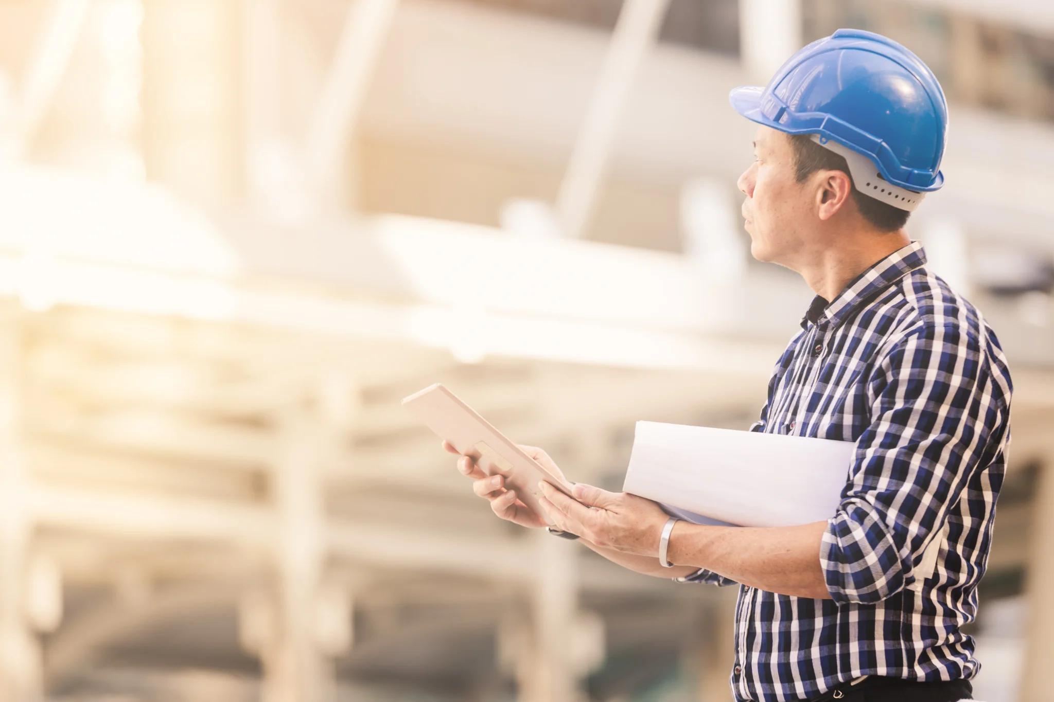 A construction worker supervises a site grateful for the AI tools he has to ensure his project is run smarter.