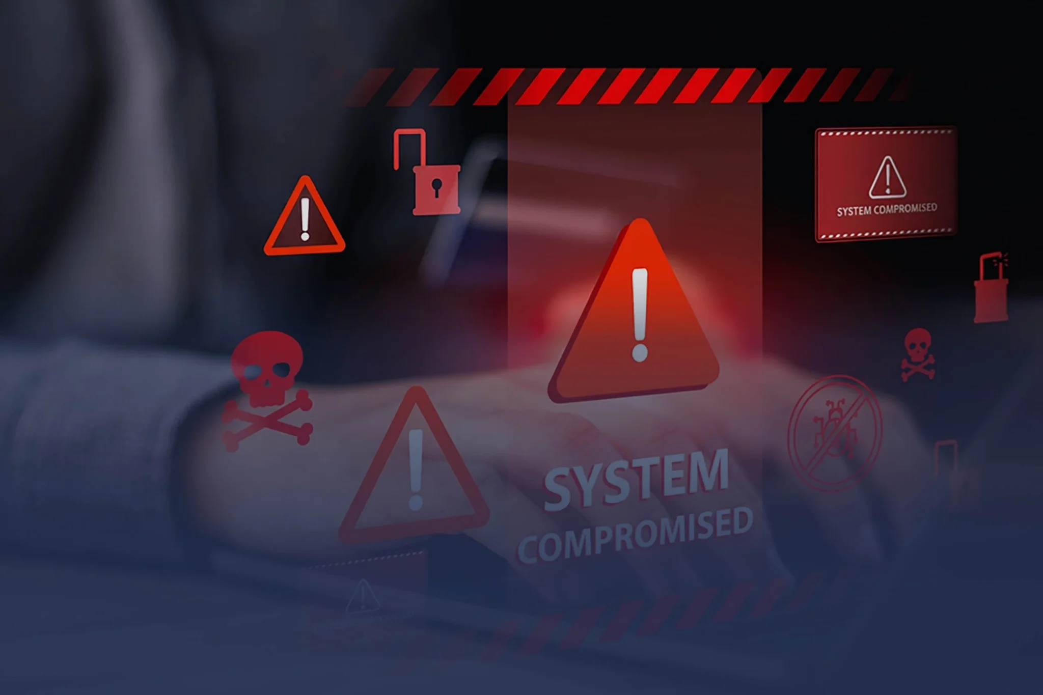A business owner receives alerts on their laptop with warnings of a compromised system.